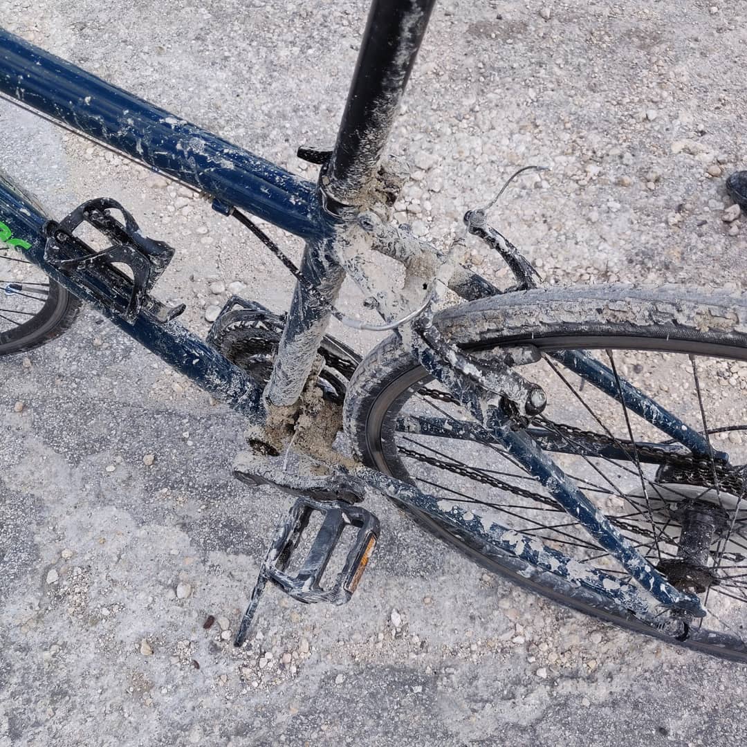 Bike covered in dirt after riding through the Everglades.