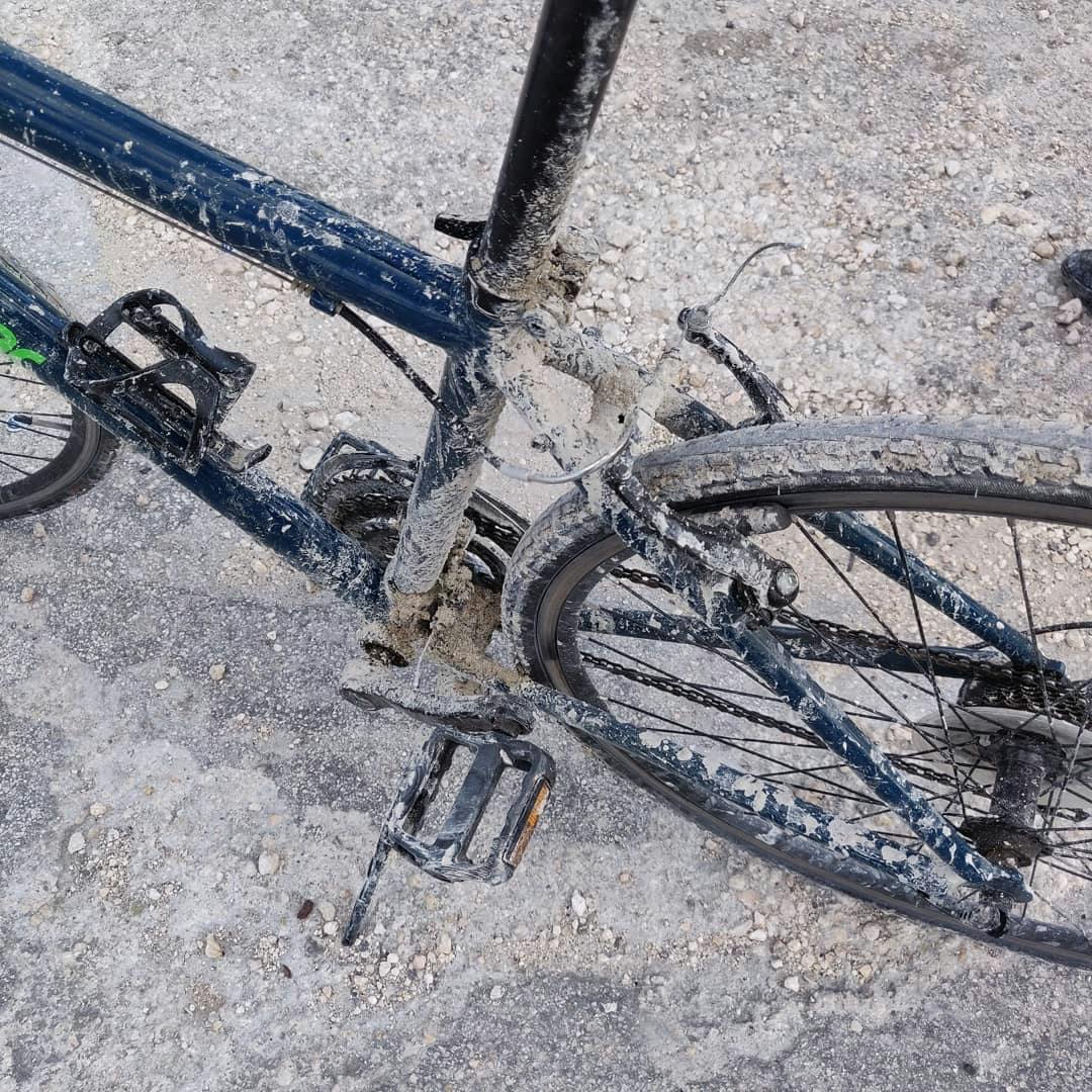 Bike covered in dirt after riding through the Everglades.